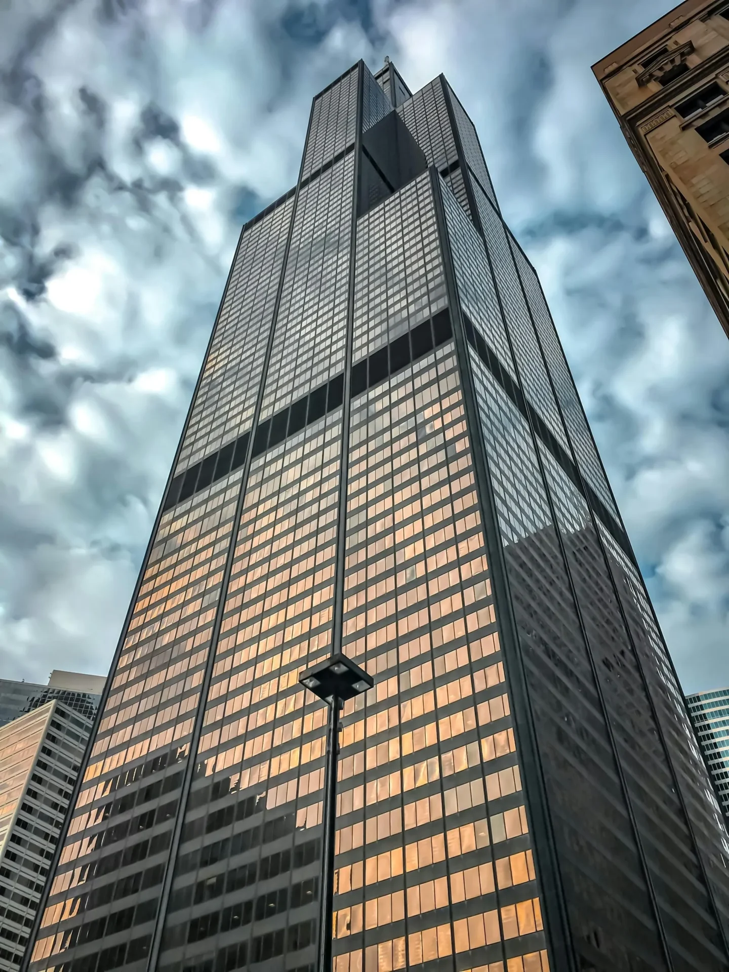 A building with many windows and a sky background